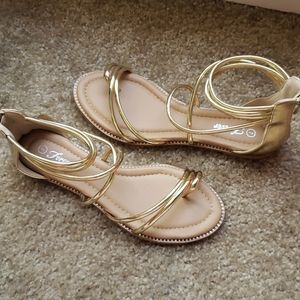 Gold with diamonds open toe sandals.